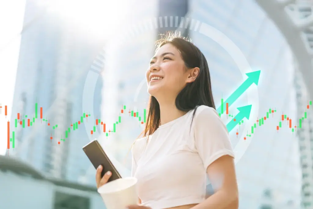 Frau mit Smartphone vor Finanzdiagramm – Financipation Club